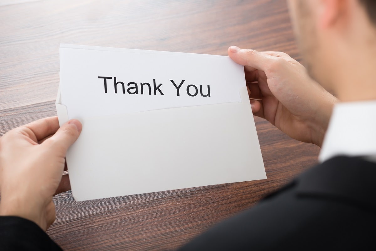 Businessman Holding Thank You Card