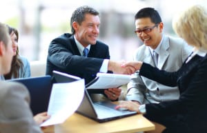 Business people shaking hands, finishing up a