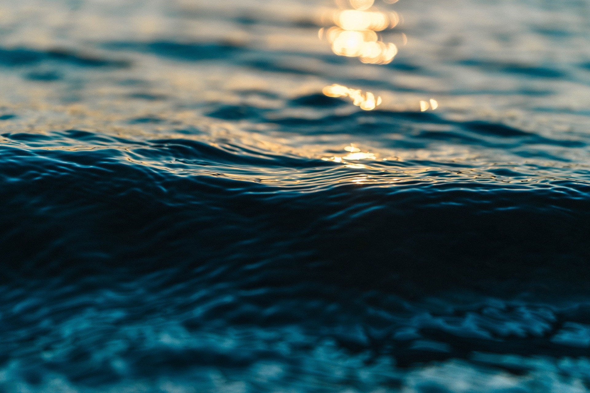 waves of water with reflection of sunlight