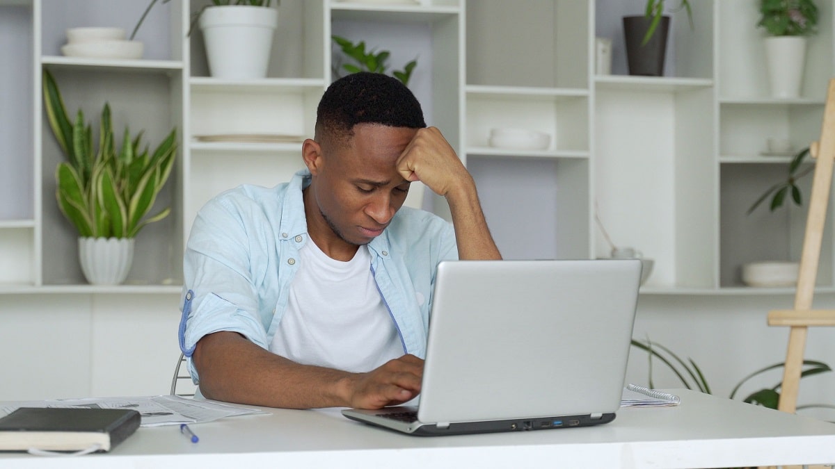 Young man depressed after job loss.